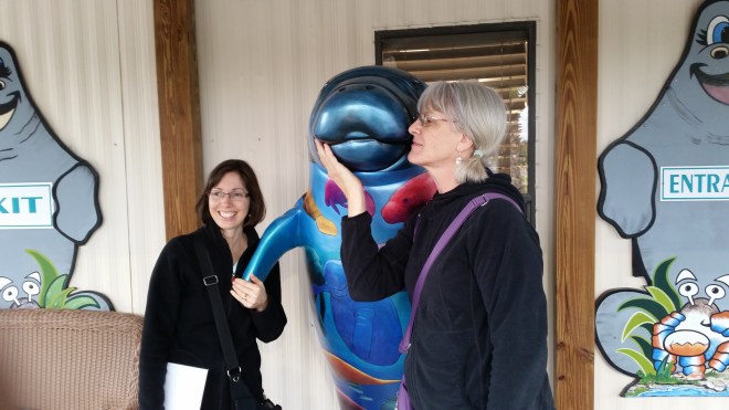 Me and my sister-in-law with our manatee friend, appropriately blue with cold.