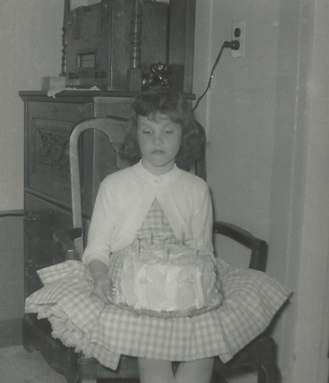 Oh please, another birthday? Can't you take a picture of me when I feel like smiling? Nice cake though.