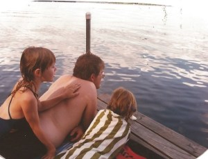 My girls and their dad enjoying a moment on the dock after a swim. 