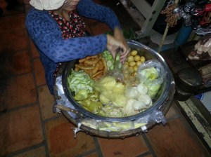 Russian market food section has many small vendors like this lady.