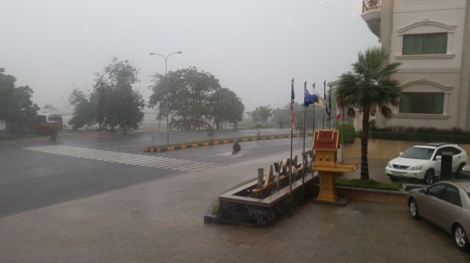 Rain, rain, go away... notice the moto leaving a wake as it travels down the road.