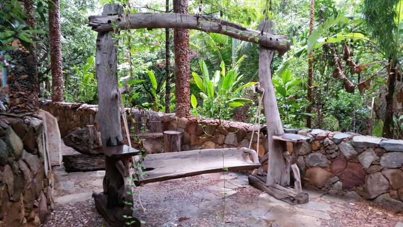 Swing seating made of natural wood pieces