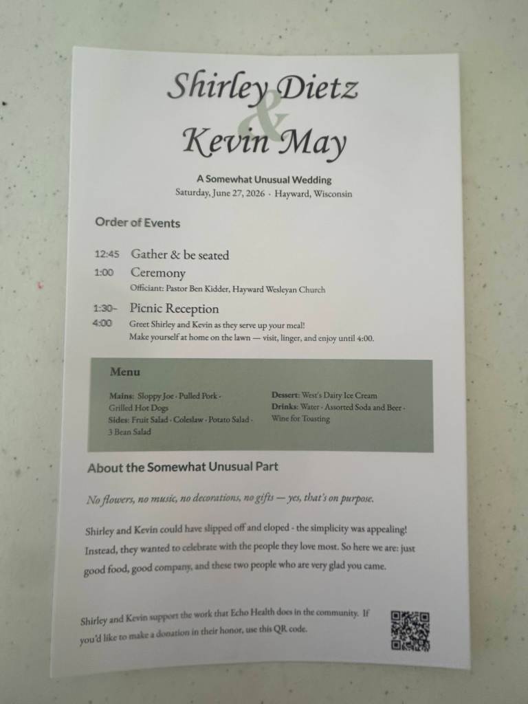Wedding invitation for Shirley Dietz and Kevin May, dated June 27, 2026, in Hayward, Wisconsin, detailing the order of events, menu, and a note about the couple's unique wedding style.